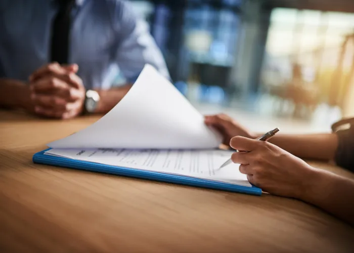 woman flipping through paperwork