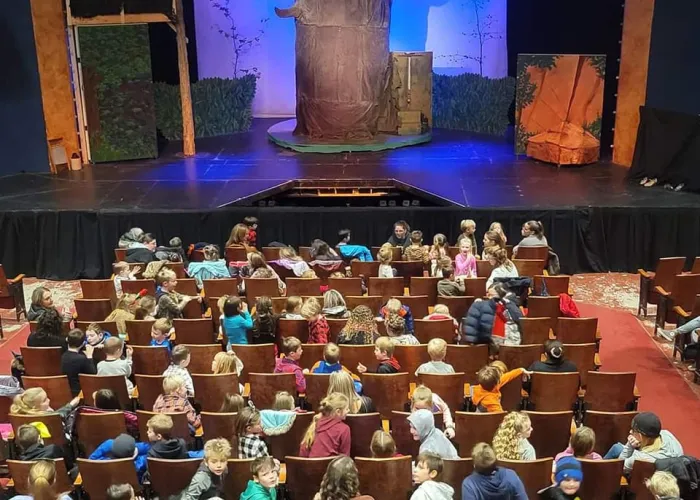 Crowd of people waiting for a show to start inside the Stirling Festival Theatre